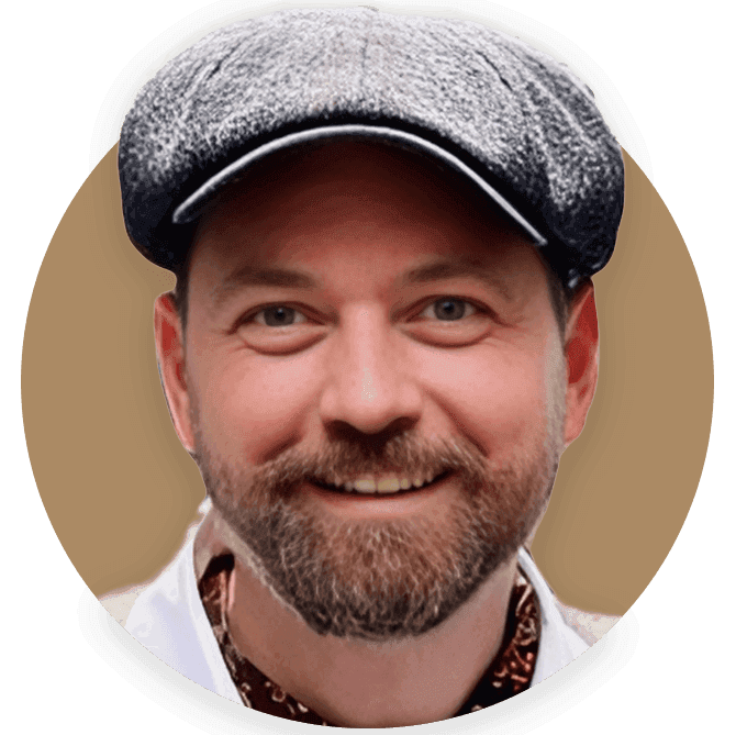 Jack Harris, founder of Tally Ho, smiling and wearing a tweed cap