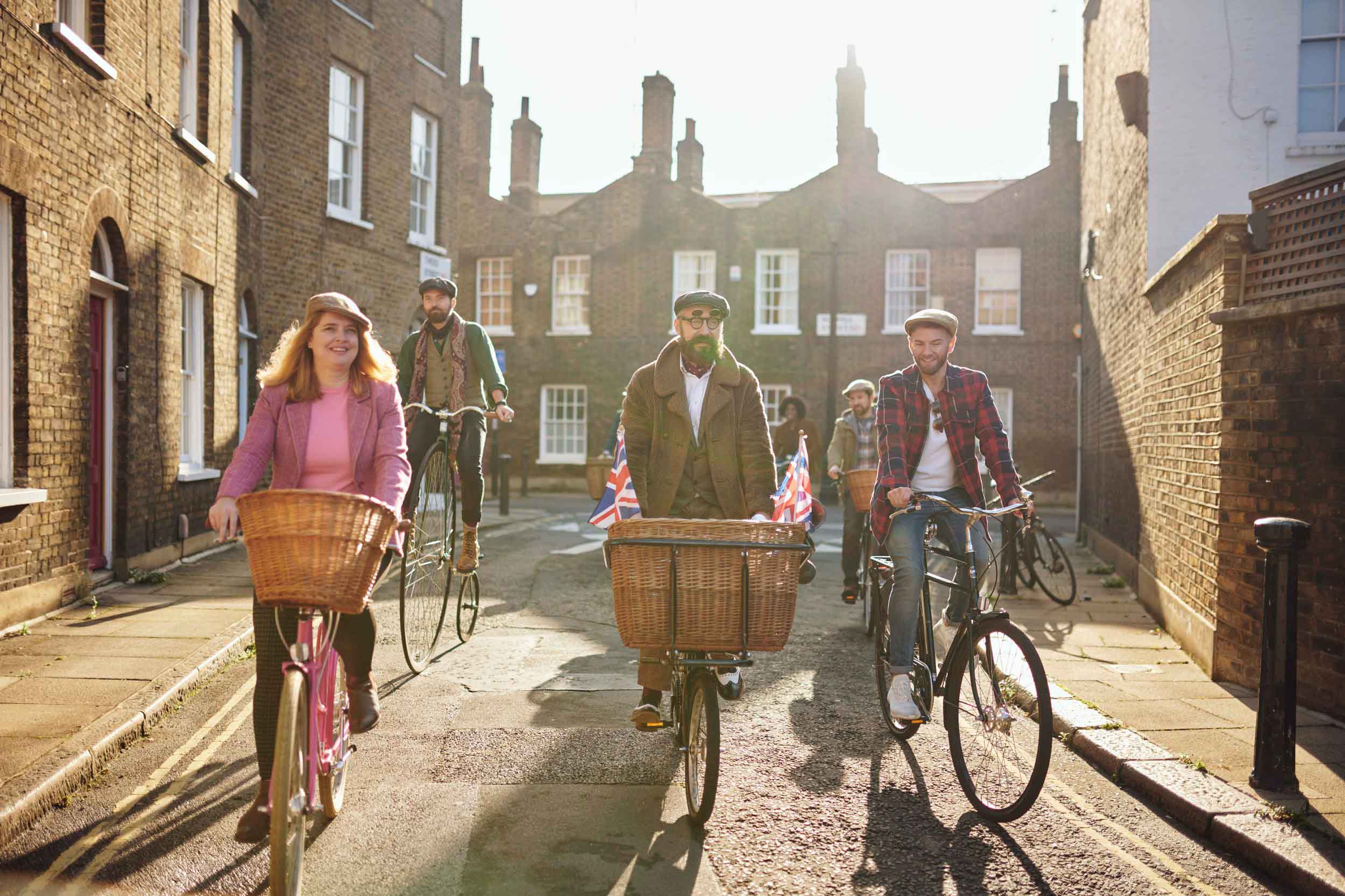 Tally Ho guests riding vintage bikes in the back streets of London